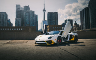 White yellow sports car cityscape - andrew law free wallpaper