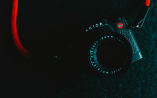 Camera red strap black surface - leica free wallpaper