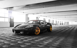 Black sports car yellow rims 3 - a parking garage free wallpaper