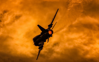 Fighter jet cloudy sky yellow - colin hayes free wallpaper
