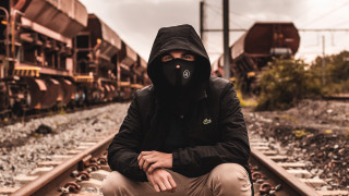 Man black hoodie train track - a black mask free wallpaper for desktop