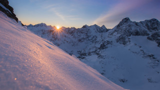 Snowboarder sunset mountains lake cityscape - a snowy hill free wallpaper