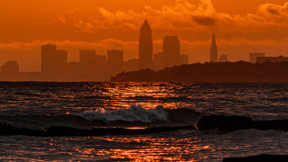 City skyline ocean sunset waves - the rock free wallpaper