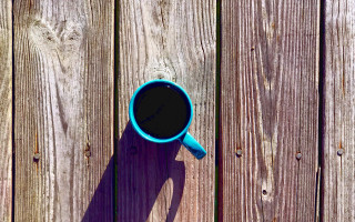 Blue coffee cup wooden table - a shadow of a person free wallpaper