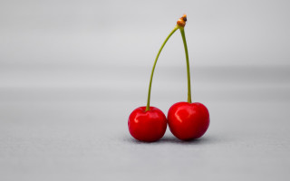 Cherries tiltshift red green stem - a table together free wallpaper for desktop