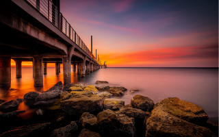 Pier sunset rocks water cityscape - arthur sarkissian free wallpaper