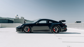 Black sports car parking lot 25 - a black sports car free wallpaper