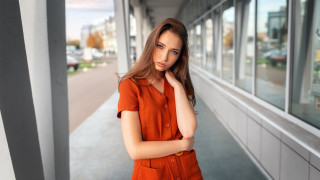 Orange shirt woman outdoor portrait - outside a building free wallpaper