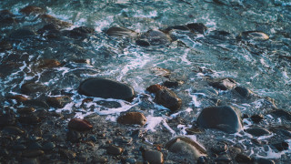 Rocks water beach surfboard ocean - a bunch of rocks free wallpaper