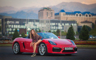 Woman red sports car cityscape 2 - the hood free wallpaper