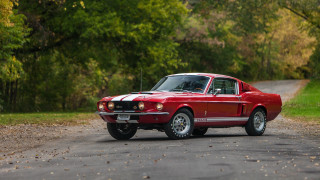 Red car parked woods trees - area free wallpaper
