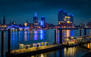 City skyline dock lit buildings - free city wallpaper