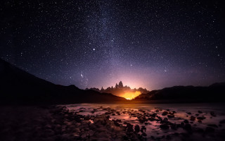 Night sky mountains lake rocks - star and a mountain range in the background free wallpaper
