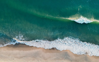 Beach wave surfboard ocean night - a view of a beach free wallpaper for desktop