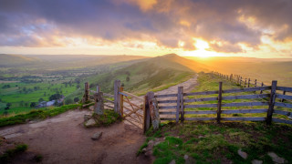 Wooden gate hill sunset mountains - a sunset in the background and a mountain in the distance free wallpaper