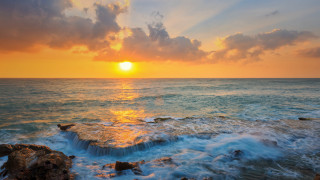 Sunset ocean waves rocks clouds - a sunset over the ocean free wallpaper