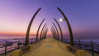 Ocean sunset walkway benches streetlight - a long walkway free wallpaper