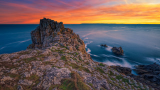 Rocky cliff water sunset bridge - the foreground and a sunset in the background free wallpaper for desktop