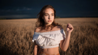 Wheat field woman crossed arms - a field of wheat free wallpaper