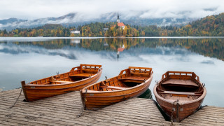 Wooden boats lake church foggy - lake free wallpaper