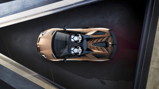 Gold sports car above parking - a black floor free wallpaper for desktop