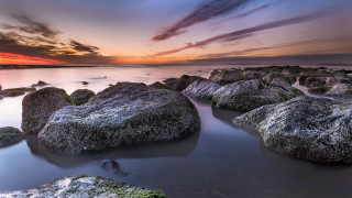 Sunset rocky beach water clouds 8 - rich moody colour free wallpaper