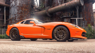Bright orange sports car factory - pipe free wallpaper