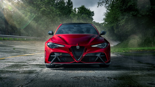 Red sports car driving forest - sun free wallpaper for desktop