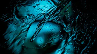 Blue water droplets face abstract - black free wallpaper for desktop