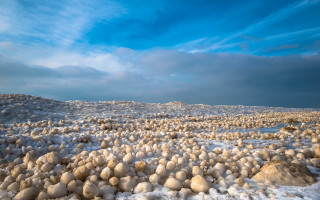 Rocky snowy hillscape blue sky - a microscopic photo free wallpaper