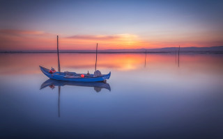 Small boat sunset water horizon - a small boat free wallpaper