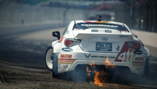 White car race track smoke 2 - dennis flanders free wallpaper