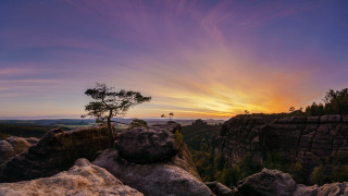 Tree rock formation sunset mountain - a colorful sky in the background free wallpaper
