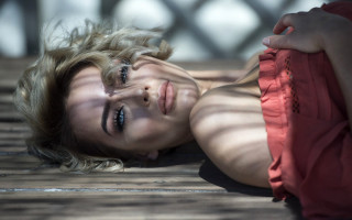 Woman bench blowing hair portrait - a wooden bench free wallpaper