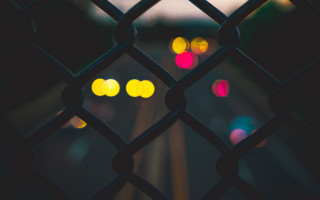 Fence lights night train track - a train track in the background free wallpaper