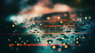 Rainy window water drops bokeh - a close up of a rain free wallpaper for desktop