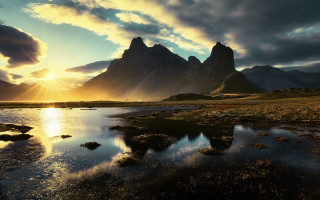Mountain range lake sunset clouds - a lake in the foreground and a sunset in the background free wallpaper