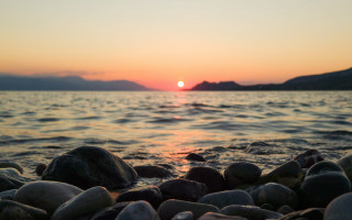 Sunset water rocks mountains orange 3 - the foreground and mountains free wallpaper