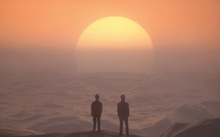 Sunset ocean rocky beach silhouettes - hazy free wallpaper for desktop