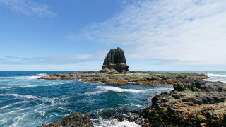 Rocky island clouds blue sky - a large rock free wallpaper
