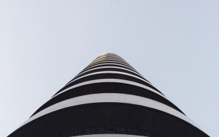 Tall building clock abstract sculpture - the top of its free wallpaper