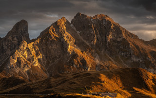 Mountain range house clouds dusk - dramatic light free wallpaper