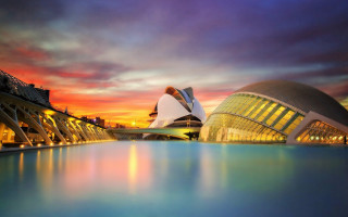 Large building water sunset cityscape - a large body of water in front free wallpaper