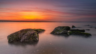 Sunset mountain shore mystical colors - the foreground and a body of water free wallpaper for desktop