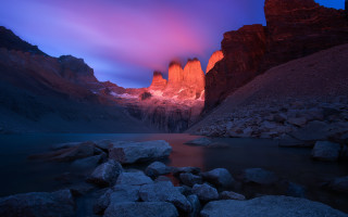Mountain lake rocks sunset mystical - the foreground and a sunset in the background free wallpaper for desktop