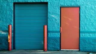 Blue building red door ocean - a blue building free wallpaper