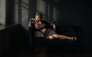 Woman couch dark room red 2 - a black chair free wallpaper