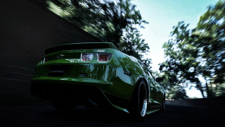 Green sports car street trees - a green sports car free wallpaper