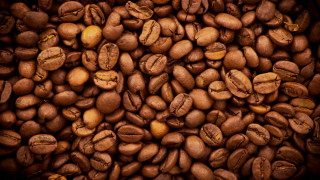 Coffee beans pile brown background - a pile of coffee beans free wallpaper
