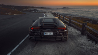 Black sports car ocean sunset - the sun setting free wallpaper